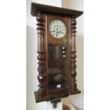 Early 20th Century walnut two train wall clock marked 'Manufactured by Waterbury Clock Co, USA'. (