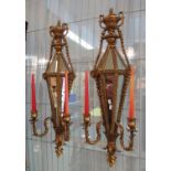 Pair of modern classical design gilded two-section mirrored wall sconces with urn and foliate
