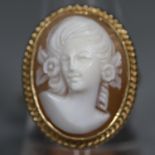 9ct gold oval shell cameo ring with gold ropework border. Ring size P. Approx weight 7.2 grams. (B.