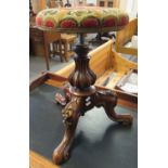 Victorian walnut adjustable piano stool with a tapestry top, having three scroll carved and