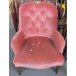 Late Victorian walnut button back upholstered low armchair on turned legs and castors. (B.P. 21% +