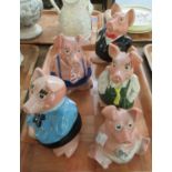 Group of five Wade pig moneybanks, one with missing stopper. (B.P. 21% + VAT)