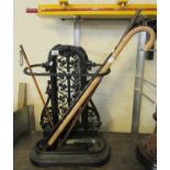 Victorian style cast iron stick stand with pierced foliate decoration, together with a collection of