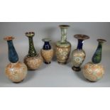 A collection of six Doulton stoneware vases of varying designs, some of baluster and some of ovoid