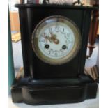 Small ebonised wooden two train architectural mantel clock. (B.P. 21% + VAT)