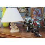 Two similar small modern Tiffany design table lamps, together with another table lamp, the base