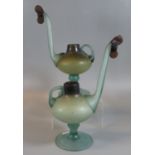 A pair of unusual probably Middle Eastern design single handled jugs or vessels, the spout with