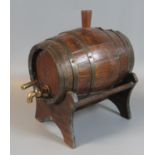 Vintage miniature oak coopered spirit barrel with brass tap on wooden stand. (B.P. 21% + VAT)