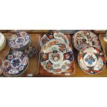 Three trays of early 20th century Japanese Imari: small chargers, plates, and a small bowl. (3) (B.