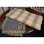 Early 20th Century multi-coloured Welsh carthen, together with a woollen Welsh check blanket. (2) (