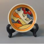 Clarice Cliff style pin tray of circular form. 7.5cm diameter approx. (B.P. 21% + VAT)