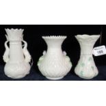 Three Irish porcelain Belleek vases; one decorated with shamrock, all with green printed marks to