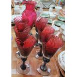 A set of six Gibraltar crystal cranberry conical wine glasses, together with a matching single