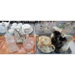 Tray of glass to include three decanters and stoppers and a cruet set with silver plated stand,