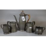 'Tudric' English pewter for Liberty & Co 01384 three piece beaten tea set, together with a pair of