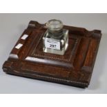 Early 20th Century oak mounted single desk glass inkwell on bun feet. (B.P. 21% + VAT)