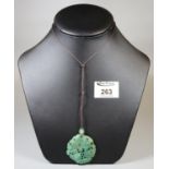 Carved greenstone pendant depicting a bat. (B.P. 21% + VAT)