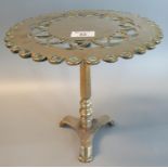 Brass trivet in the form of a pierced tripod table. (B.P. 21% + VAT)