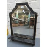 Ebonised and gilded hanging wall mirror with under-shelf. 70cm high approx. (B.P. 21% + VAT)