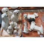 Two trays of dog figurines to include seven variously sized largely Royal Doulton Staffordshire