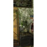 Large square garden planter with supporting frame containing black bamboo plant. (B.P. 21% + VAT)