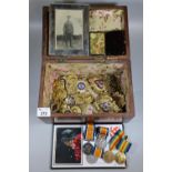 Wooden box of oddments to include King George V silver crown commemorative cover, postcard of a