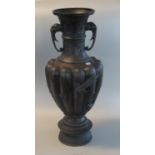 Large Japanese patinated bronze fluted baluster shaped vase with extended neck having elephant