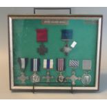 Mounted collection of British gallantry medals including Victoria Cross, DFC, MC, etc.