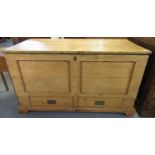 Large 19th century pine chest, the hinged lid and moulded front above two fitted drawers with brass
