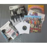 Plastic box of assorted Beatles LPs and related ephemera to include Sargent Pepper live at the BBC