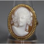 9ct gold oval shell cameo ring with gold ropework border. Ring size P. Approx weight 7.2 grams. (B.