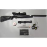 Stoeger .22 break action moderated air rifle with black plastic stock and Stoeger 3-9x40AO