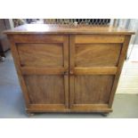 19th century mahogany two-door blind panelled free standing cupboard with fitted shelves. 102 x 48 x