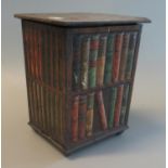 Early 20th century tin plate Huntley & Palmers bisquit tin in the form of a library with books. 13 x