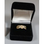 14ct gold diamond set crossover ring. Ring size P. Approx weight 2.7 grams. (B.P. 21% + VAT)