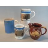 Collection of three mocha ware straight sided mugs, together with a souvenir Widecombe Fair baluster