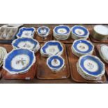 Five trays of Rockingham Works Brameld dinner ware, powder blue and gilt on a cream embossed rope-