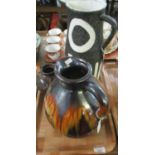 Three pieces of Art Pottery to include: large brown drip glaze jug, black and white rough finish,