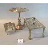 Three brass pierced trivets, one in the form of a centre table. (3) (B.P. 21% + VAT)