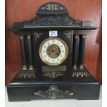 Late Victorian slate architectural design two-train mantel clock with enamel face and skeleton