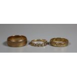 9ct gold wedding ring and two 9ct gold rings set with white stones. Ring size R, N and K&1/2. Approx