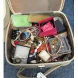 Suitcase of assorted vintage and other jewellery, bracelets, necklaces, vanity items, silver