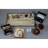 Box containing assorted cufflinks, tie pins, sterling silver cufflinks, modern pocket watch and