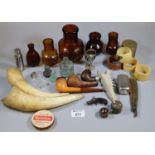 Vintage tin of various oddments to include pipes, Bovril bottles, animal horns, study of a coracle