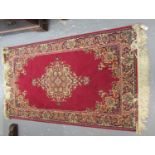 Pair of red ground Middle Eastern design rugs. (2) (B.P. 21% + VAT)