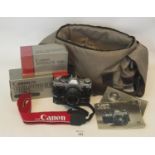 Camera case of assorted camera equipment to include Canon AE-1 camera, Canon 100-200 zoom lens,
