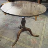 19th century oak snap top tripod table on hoof feet, diameter 73cm approx. (B.P. 21% + VAT)