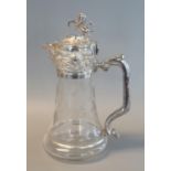 Early 20th century silver plated and glass claret jug, possibly American, having cast lion mount