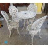 Set of four modern weathered metal pierced garden chairs with matching circular table. (5) (B.P. 21%