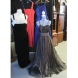 Four evening dresses to include: a brown net full length dress with spotted bronze detail, two net